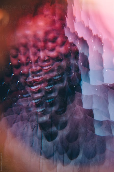 Prismatic photo of black woman with hoops and red lipstick