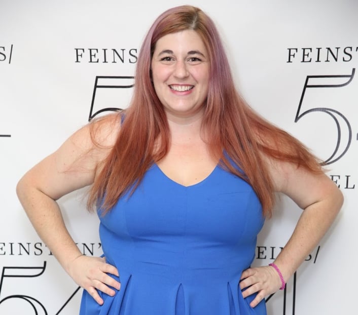 Jamie Maletz standing in front of step and repeat at Feinstein's 54