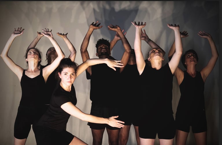 ShaleighDanceWorks performers dancing in unison with hands raised