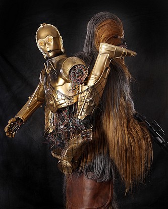 Stars Wars character carrying a broken C3P)