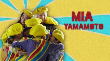 Mia Yamamoto and Kristina hug 4 kids, yellow and blue background